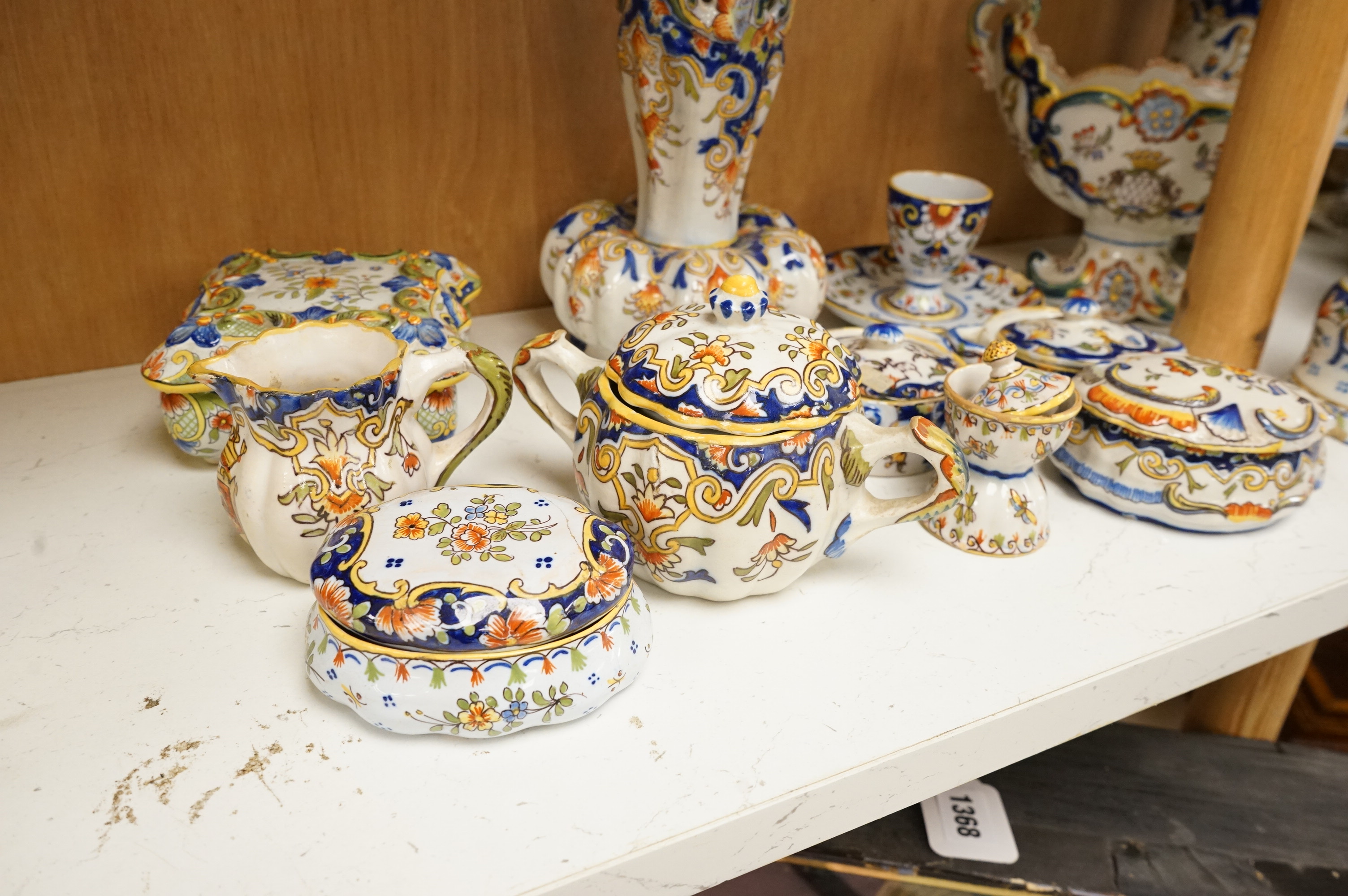 A group of French faience pottery to include trinket boxes, a teapot and vases, largest 32cm in length
